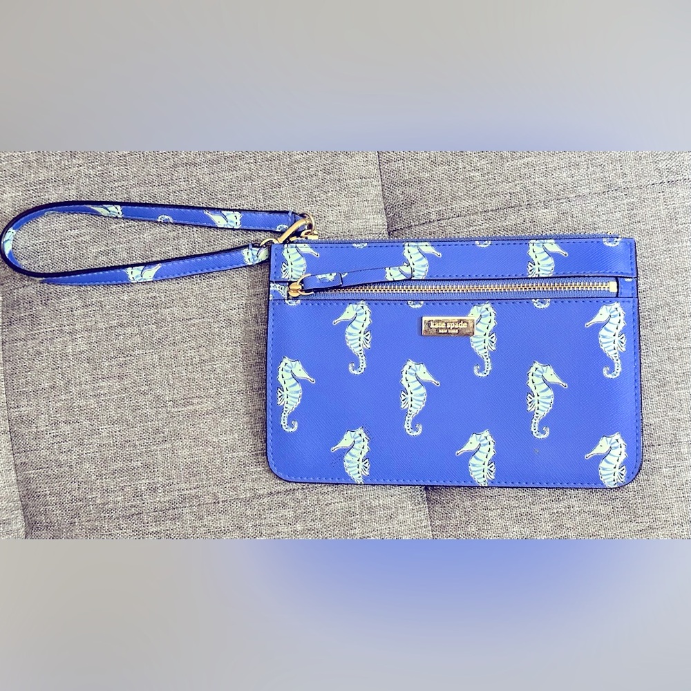 NWOT Kate Spade sea horse wristlet. Never used. Smoke free home.